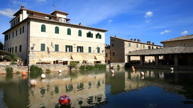 Beautiful pond with mineral water from the source on the center square of Bagno Vignoni old town, Tuscany, Italy