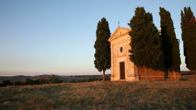 The magnificent ascetic old Cappella of Madonna di Vitaleta 1590 on a hill near the town of San Quirico attracts many tourists and is an architectural landmark of Tuscany, Italy