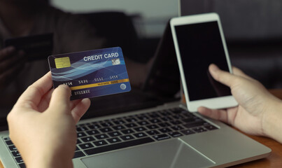 woman holding credit card and use laptop for with shopping online. Online payment concept.