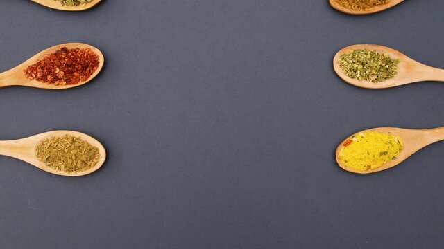 Wooden spoons with spices appear on left and right side - Stop motion 