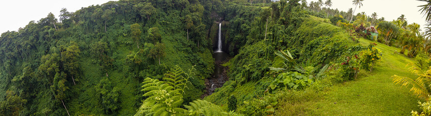 Panoramic view of Sopoaga Waterfall amongst the dense forest in Samoa