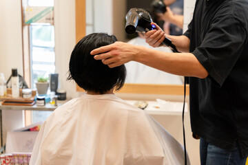 Filming the work of a Japanese barber