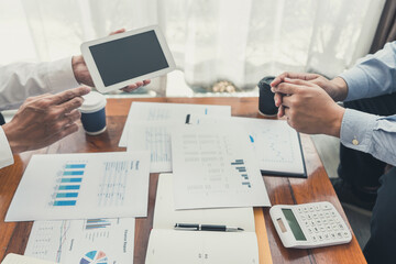 teamwork company meeting concept, business partners working with laptop computer together analysing startup financial project result or strategy plan and discussing data document in office.