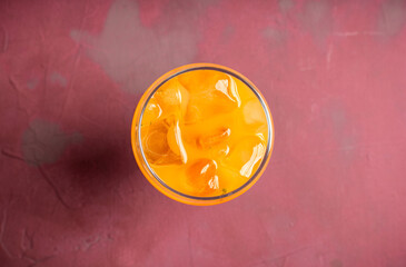 Orange cocktail on rustic background. Selective focus. Shallow depth of field.
