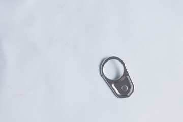 One metal ring pull for canned food or drinks isolated over white background.