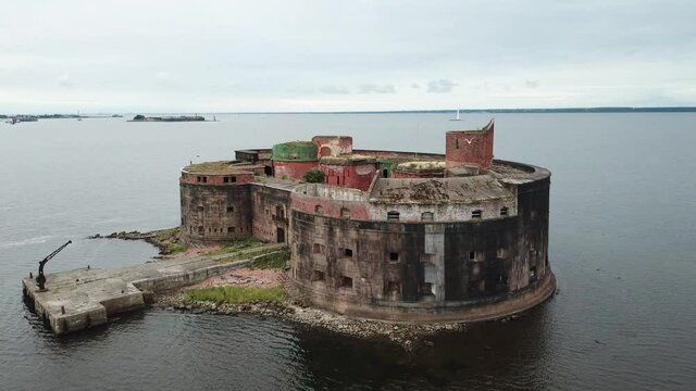 4K aerial cloudy morning video of Fort Alexander 1 bastion, its fortifications, armaments and Baltic Sea Finnish Bay panorama near Kronstadt and Saint Petersburg in northern Russia