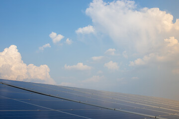 solar panel on a tall building with a sky background shining in the late morning It is a technology for renewable clean energy.