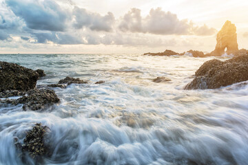 Motion of sea with large rocks near land