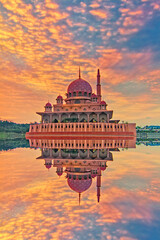 Beautiful architectural design of Putra Mosque with magnificient sunrise at the background