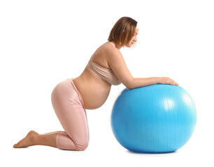 Fototapeta na wymiar Young pregnant woman with fitball on white background