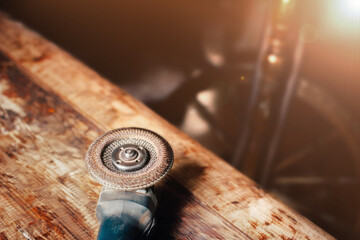 grinder on a wooden board, woodworking concept in a workshop.