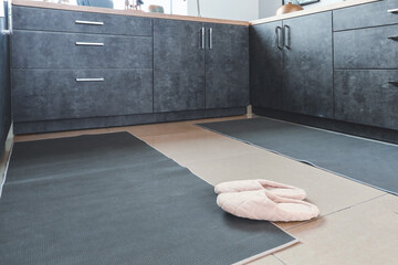 Stylish carpets on floor in modern kitchen