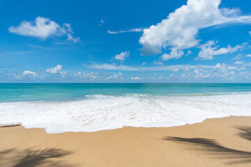 tropical beach with blue sky and clouds