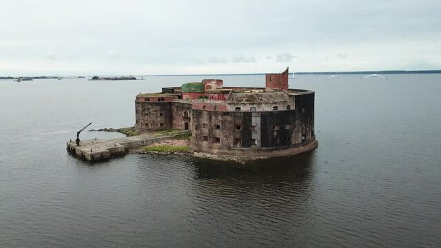 4K aerial cloudy morning video of Fort Alexander 1 bastion, its fortifications, armaments and Baltic Sea Finnish Bay panorama near Kronstadt and Saint Petersburg in northern Russia