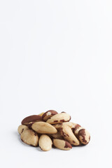 handful of Brazilian walnuton on a white background. close-up of raw nuts. healthy food isolated. copy space for text.