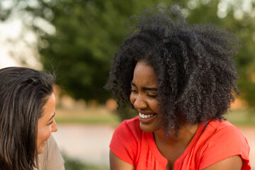 Diverse group of friends talking and laughing.