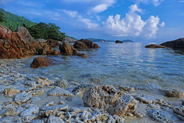 Beautiful landscape view of a coral filled beach in Perhentian Island. Soft focus effect due to usage of big aperture setting.