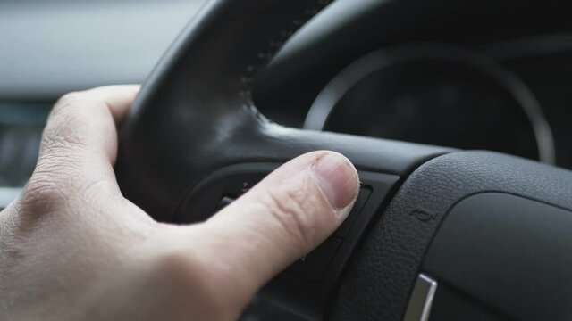 Finger Controls Buttons On Car Steering Wheel.