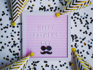 Happy Father's day. Greeting card with mustache and glasses, confetti and party caps, holiday concept. Father's day concept. 