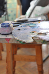 artist brushes on a wooden background