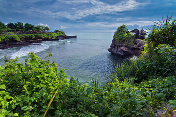 Winde angle shot of the cliff surrounding the Tanah Lot in Bali.