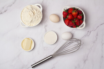 ingredients for baking strawberry muffins.