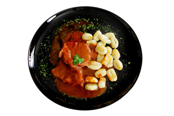 Pasticada with gnocchi, beef stew in a sauce. Croatian cuisine
