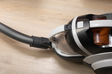 Cleaning with vacuum cleaner. Appliances for housekeeping, cleaning house