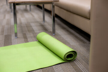green yoga mat in the office