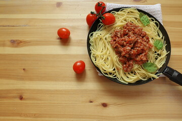 pasta Bolognese in a pan, cooking at home Italian dishes, serving in a pan, Italian cuisine, spaghetti with meat sauce