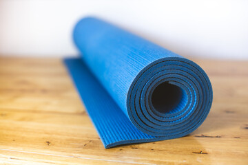 Blue yoga mat for seat or exercise