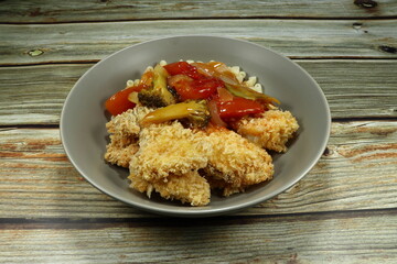Deep fried crispy fish and boiled macaroni noodle topping with local tomato sauce and mixed vegetable, broccoli, tomato, string bean and onion. Famous fusion steak menu in Asian style 