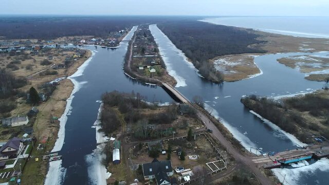 View of two old Svir channels on a March day (aerial video). Leningrad region, Russia