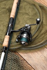 Naklejka premium spin fishing rod and reel isolated. fishing tackle