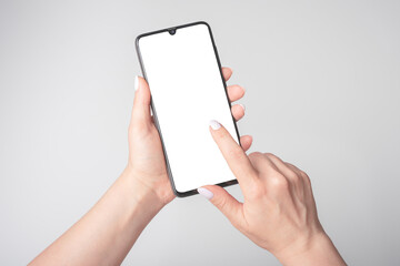 Female Hands Holding Mobile Cell Phone With Blank Screen, mockup phone