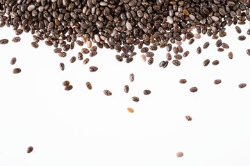 Small group of chia seeds isolated on white background. Closeup. Top view. Chia super food.