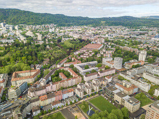 Aerial view of buildings and urban cityscape with streets in overhead view. Beautiful roof of urban housing.Zurich city in  Switzerland in Europe from above.
