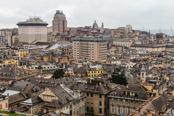Fototapeta na wymiar View from above of the old historical center quarter and modern districts of european city Genoa
