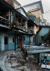 old downgrade residence area on slopes, ancient wooden house in cyan at Da Lat, Vietnam