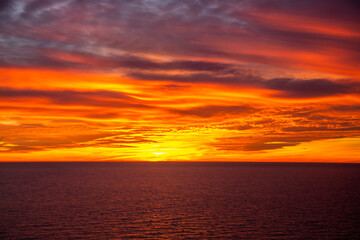 Fototapeta na wymiar Beautiful dark orange sky evening beauty and Clouds at sunset