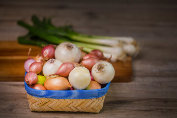 Variety of onions. In the frame, onions, shallots, white, sweet red, yellow onions, green onions.