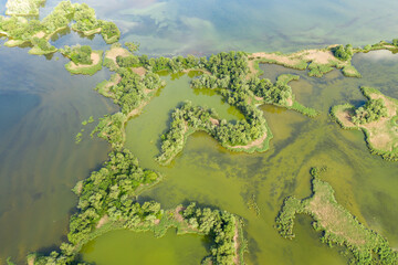 aerial view of islands with lush greenery in a freshwater river in summer. European landscape.