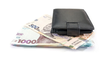 black men's wallet and stacks with 1000 and 500 hryvnia. White background.
