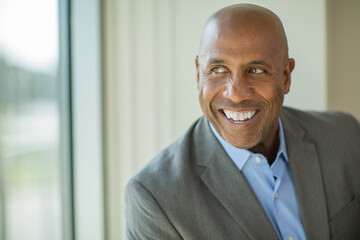 Fototapeta premium Happy mature African American man at work.