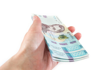 1000 hryvnia on a palm isolated on a white background.