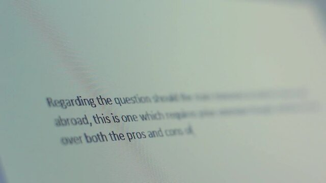 Close up of screen as text appears and shifts out of focus