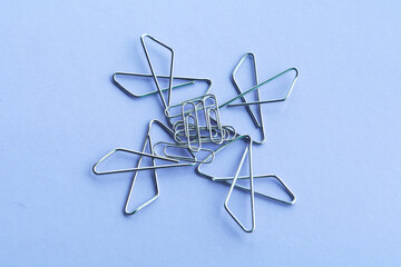 Fototapeta na wymiar paper clips . The idea for the design of school notebooks.