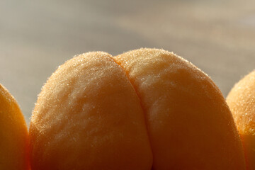 closeup apricot in backlight on a wooden background
