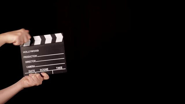 This stock video shows a film clip that is clamped against a black background. This video was shot 3840x2160 (4K) without a face