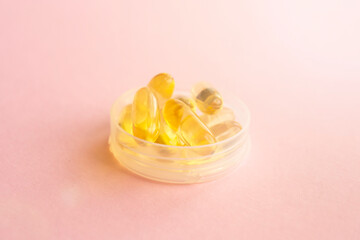 Fish oil capsules with omega 3 and vitamin D, healthy concept